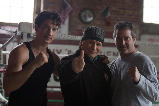 Teller and producer Chad Verdi join the real life Vinny Paz on the set. 
