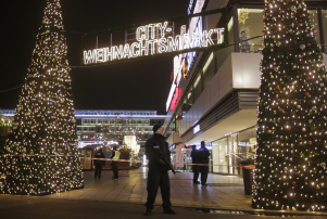 Police guard a Christmas market after a truck ran into a crowded Christmas market and killed several people in Berlin, Germany, Monday, Dec. 19, 2016. (AP Photo/Markus Schreiber)