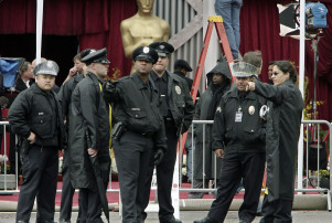 Los Angeles Police Department officers gather outside the Kodak Theatre for the 80th Annual Academy Awards Sunday, Feb. 24, 2008, in the Hollywood section of Los Angeles. (AP Photo/Ric Francis)