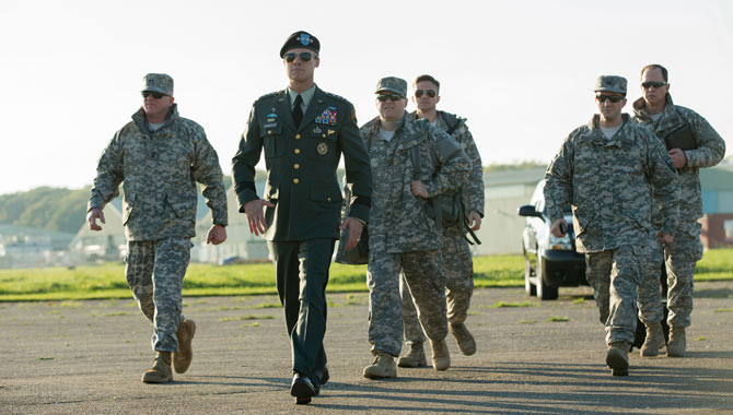 Brad Pitt and co-stars including Topher Grace in War Machine